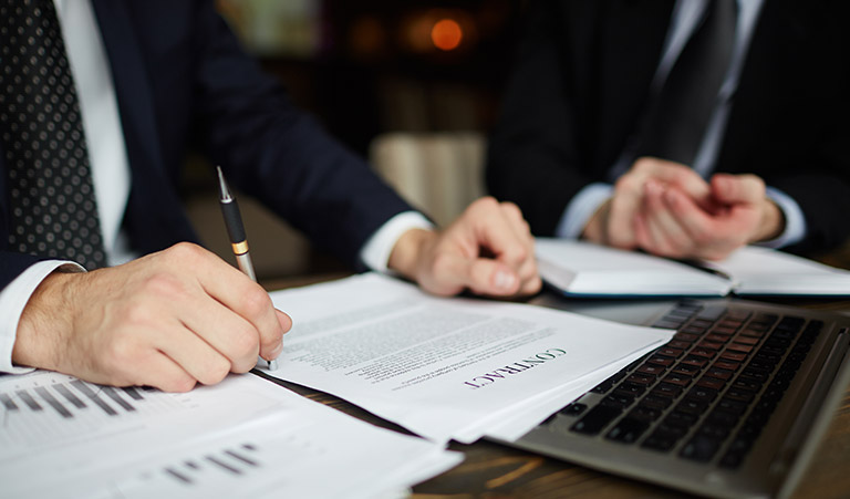 businessman-reading-contract-closeup