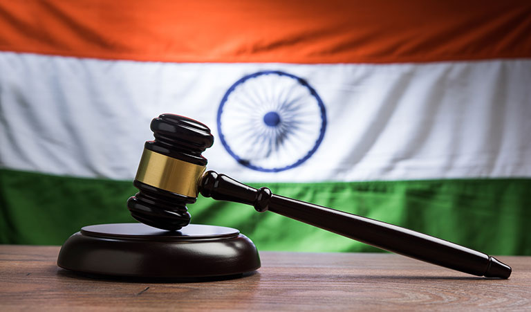 indian-law-concept-showing-wooden-gavel-indian-flag-(1)